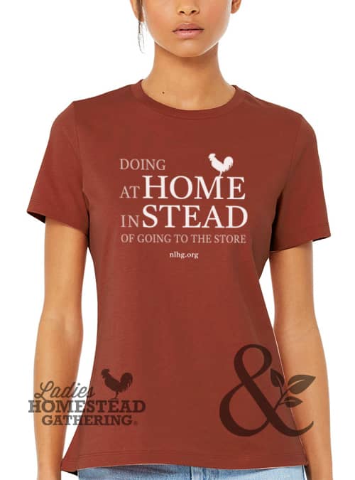 The National Ladies Homestead Gathering desires to empower women through homesteading and offers a great definition of homesteading – Doing at home instead of going to the store! Every sale of this tee goes to support the National Ladies Homestead Gathering and helps to further their mission to: Share Knowledge. Build Community. Grow Friendships.